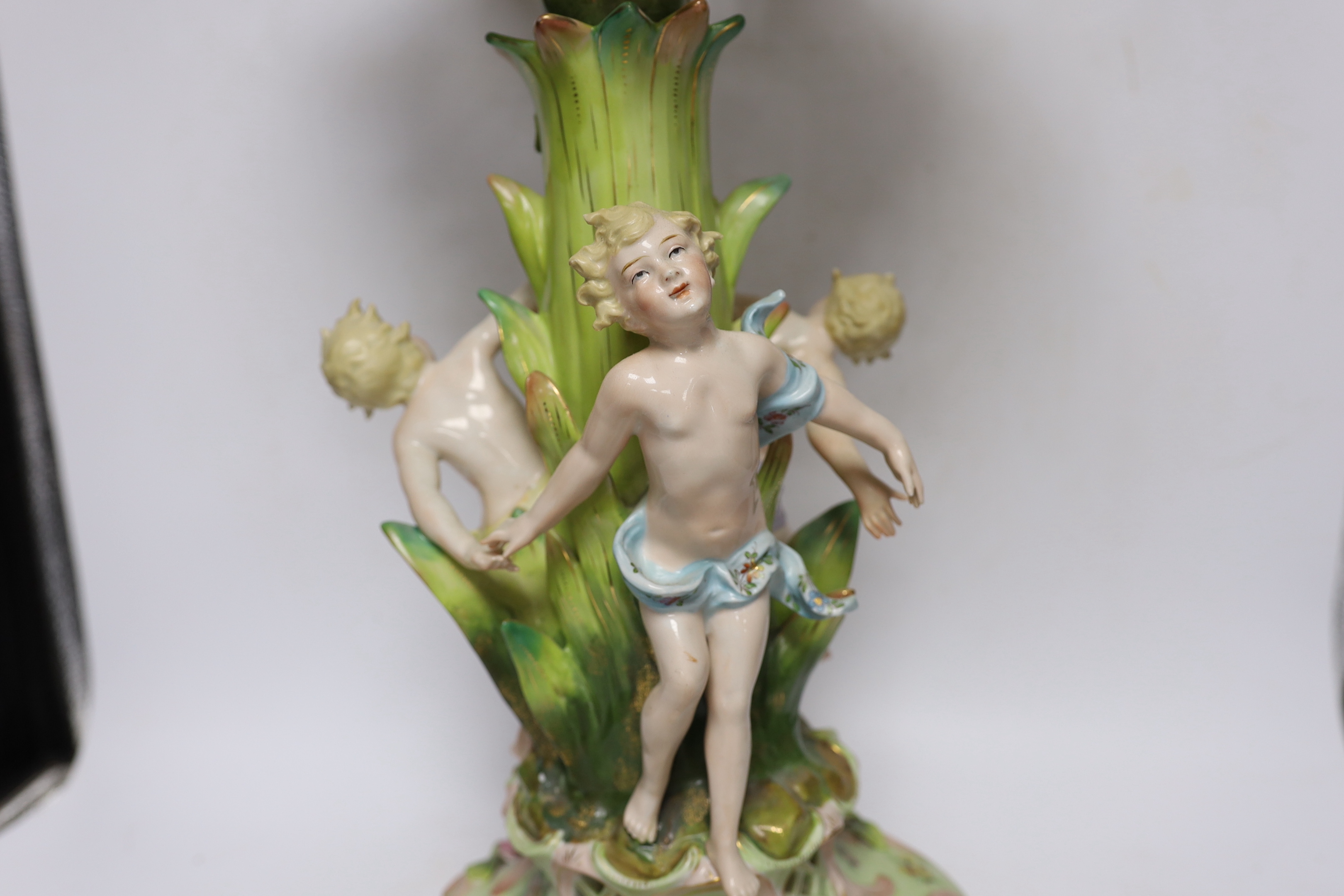 A Sitzendorf figural centrepiece, a smaller similar centrepiece and an English porcelain basket, tallest 54cm